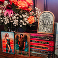 Load image into Gallery viewer, Tarot cards with 'The King' and 'The Queen' displayed in front of a bouquet of flowers and a wooden sign.