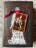 Load image into Gallery viewer, Tarot Card ornament titled "The Second Daughter" with maroon ribbon and book underneath.
