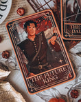Load image into Gallery viewer, A decorative shelf sign featuring the 'The Future King' tarot card from the Blood and Ash series, with decorative elements in the background.