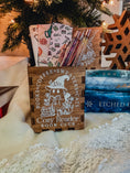 Load image into Gallery viewer, Wooden box with printed design with 'Cozy Reader' text and a ghost with books, against a book stack and Christmas tree background.