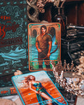 Load image into Gallery viewer, Tarot cards with 'The King' and 'The Queen' on a mystical table setting.