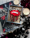 Load image into Gallery viewer, Bite Me Shelf Sign - FireDrake Artistry® wooden sign with natural background, dark grey frame, white "Bite Me" wording and red vampire lips.
