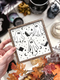 Load image into Gallery viewer, Boo Books Shelf Sign. A white. wooden square sign with a wood frame featuring illustrations of ghosts, books and stars. 2023 FireDrake Artistry®