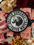 Load image into Gallery viewer, Shifter Romance - Fated Mates Round. White wooden round sign with a black border, UV printed wolf design with circling text that reads "SHIFTER ROMANCE FATED MATES". 2025 FireDrake Artistry®