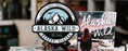 Load image into Gallery viewer, Officially Licensed K.A. Tucker "Alaska Wild Round Sign" created by FireDrake Artistry®
