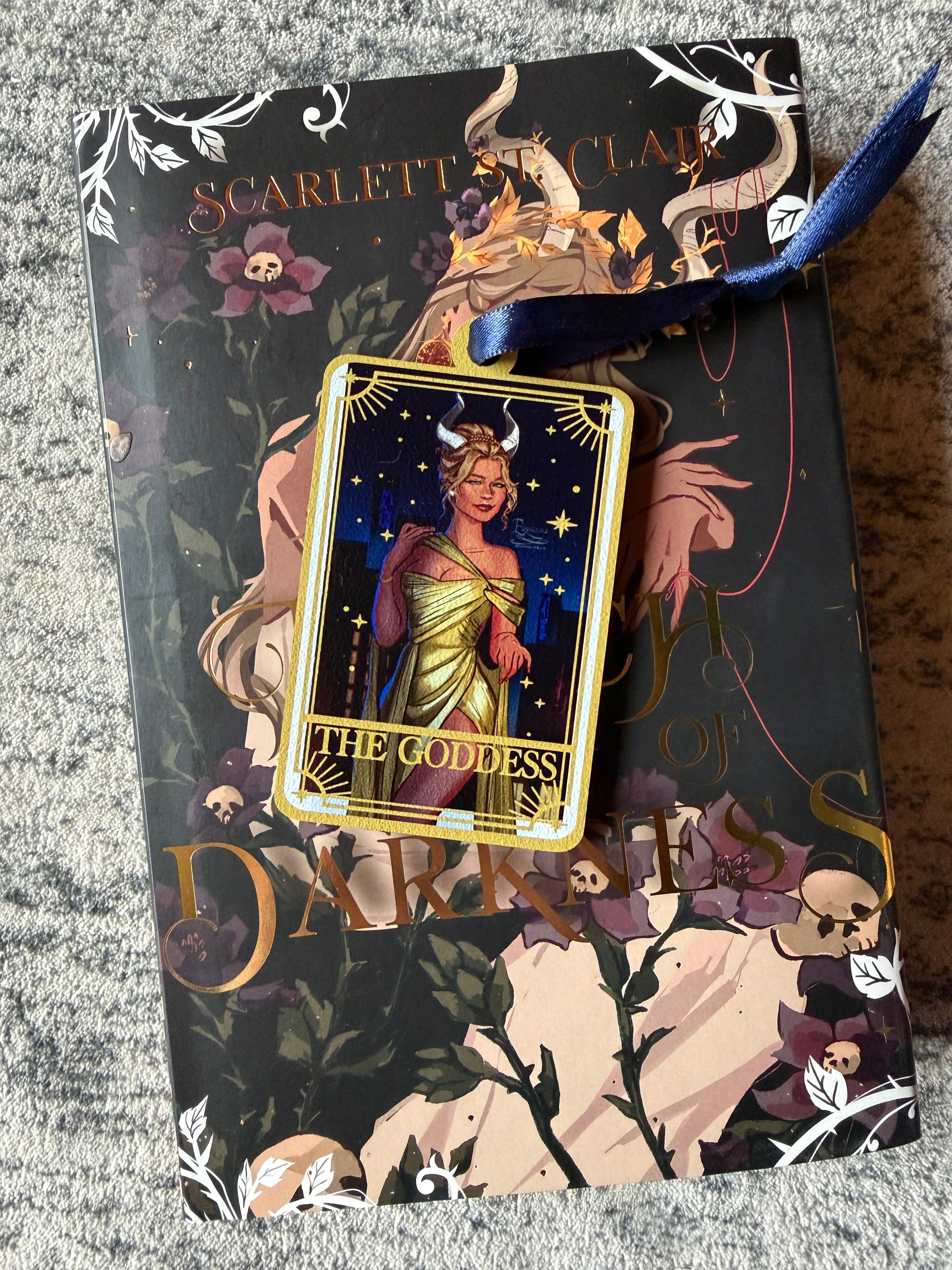 Tarot Card ornament titled "The Goddess" with blue ribbon and book underneath.