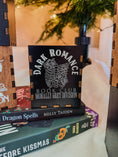 Load image into Gallery viewer, Black box with printed design with 'Dark Romance' text, against a Christmas tree background.
