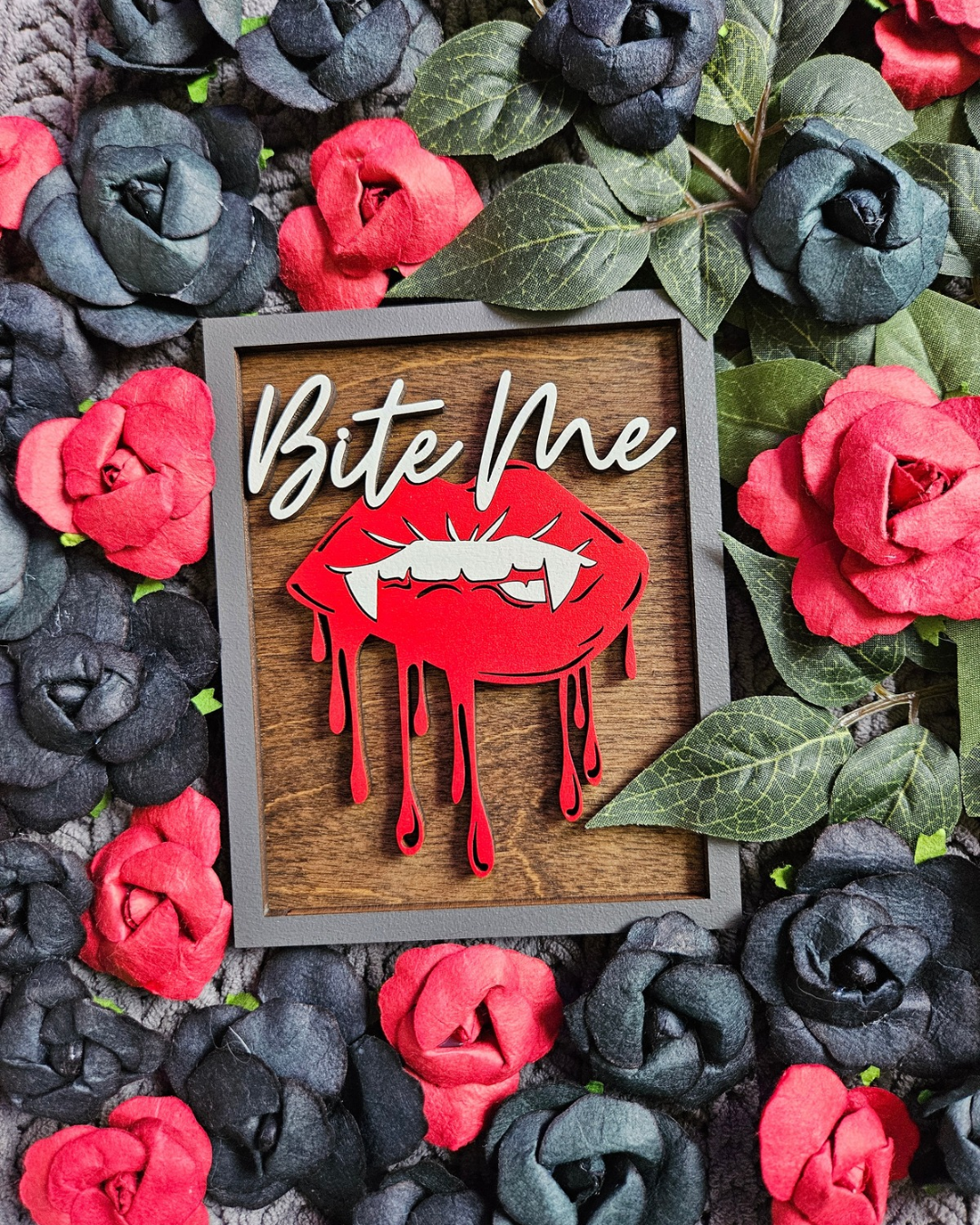 Bite Me Shelf Sign - FireDrake Artistry® wooden sign with natural background, dark grey frame, white "Bite Me" wording and red vampire lips. 