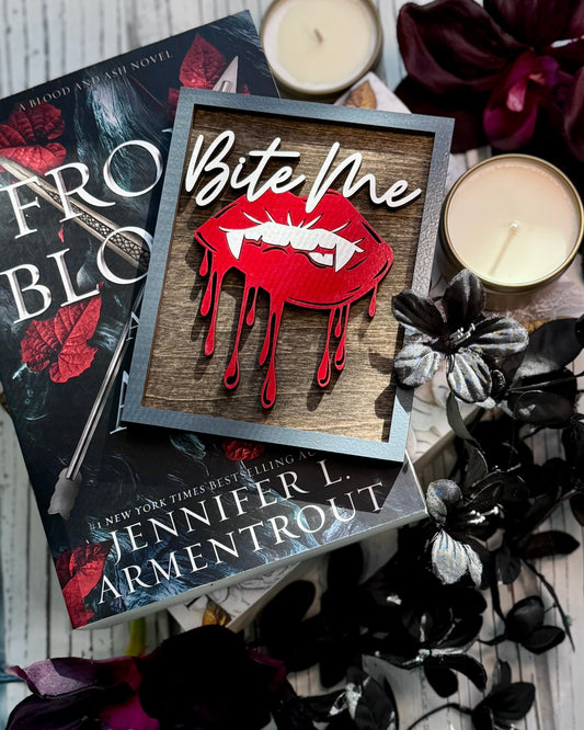 Bite Me Shelf Sign - FireDrake Artistry® wooden sign with natural background, dark grey frame, white "Bite Me" wording and red vampire lips. 