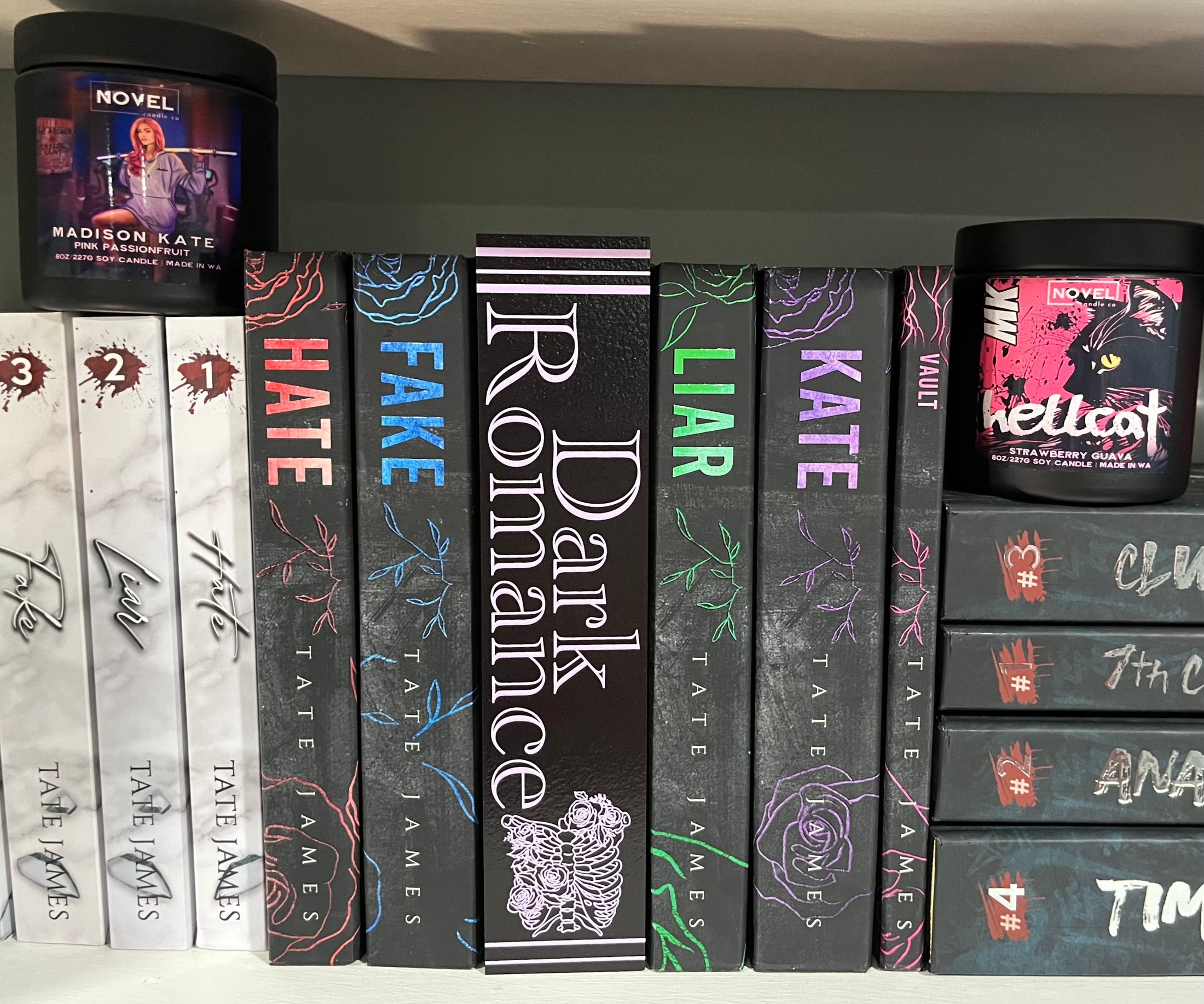 Vertical Black & Purple Dark Romance Shelf Mark™. Black wood background with purple UV printed text that reads “Dark Romance” featuring a rib cage surrounded by flowers.  ©️2024 FireDrake Artistry® 