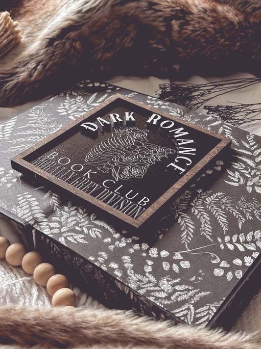 Dark Romance Book Club Sign . A decorative wooden book club sign with a dark brown border and black background. UV printed design that reads "DARK ROMANCE" at the top, and "Book Club Morally Grey Division" on the bottom. 2025 FireDrake Artistry®
