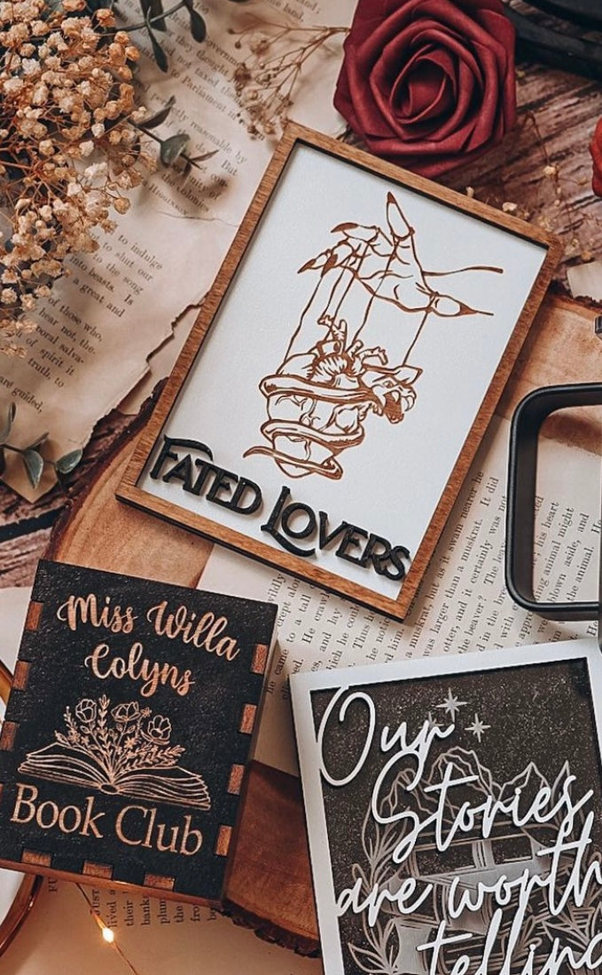 Fated Lovers, Miss Willa Colyns Book Club, and Our Stories are Worth Telling signs by FireDrake Artistry™. Photo credit @dailybookrecs