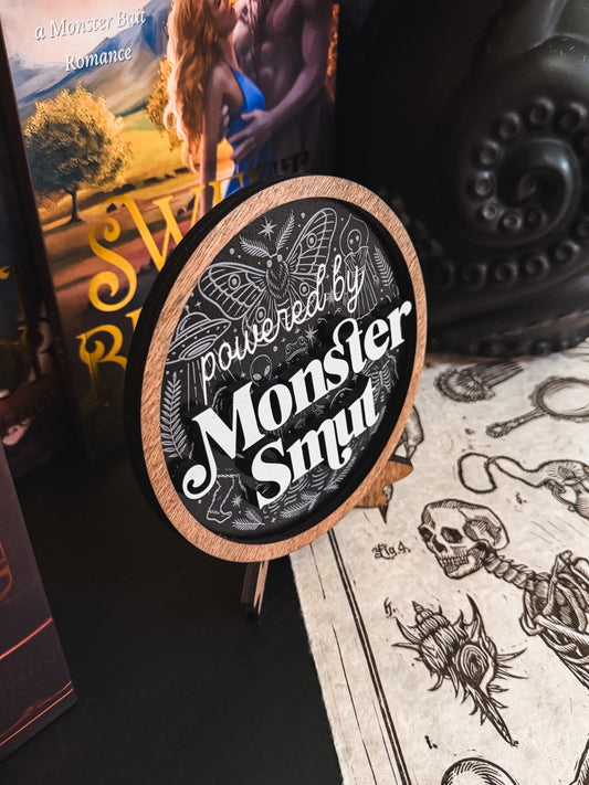 Powered by Monster Smut Shelf Sign