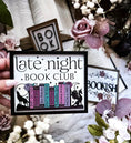 Load image into Gallery viewer, Late Night Book Club Sign. A white wooden shelf sign with a black border. UV printed design that reads "LATE NIGHT BOOK CLUB" above an assortment of books with a wolf and dragon bookends. 2024 FireDrake Artistry® Photo courtesy of @barkerbookshelf
