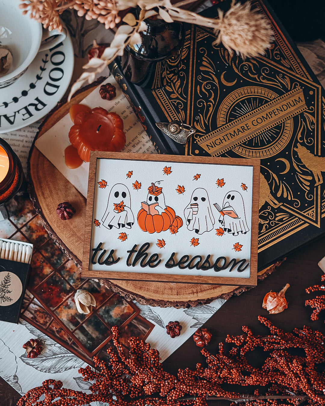 Tis the Season Ghosts Sign - Orange Fall version. A decorative wooden sign featuring UV-printed cartoon ghosts, pumpkins, and the phrase 'tis the season'. FireDrake Artistry 2024